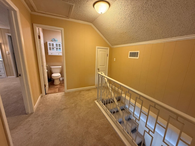 905 Cloverdale Ct, Fort Walton Beach, FL 32547 - hallway with vaulted ceiling, carpet floors, a textured ceiling, and crown molding