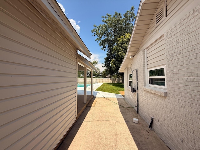 905 Cloverdale Ct, Fort Walton Beach, FL 32547 - view of home's exterior featuring brick siding and a patio