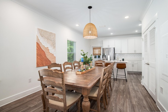 148 N Sand Palm Rd, Freeport, FL 32439 - dining room featuring dark wood-type flooring, recessed lighting, and ornamental molding