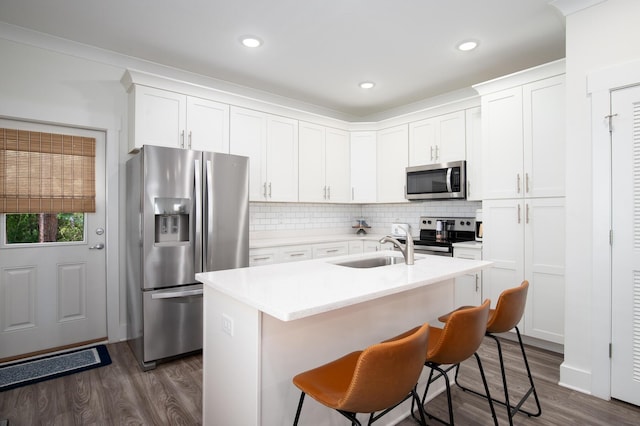 148 N Sand Palm Rd, Freeport, FL 32439 - kitchen featuring appliances with stainless steel finishes, dark wood-type flooring, white cabinetry, and recessed lighting