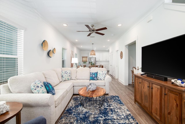 148 N Sand Palm Rd, Freeport, FL 32439 - living area featuring light wood finished floors, a ceiling fan, recessed lighting, and crown molding