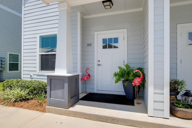 148 N Sand Palm Rd, Freeport, FL 32439 - doorway to property with covered porch