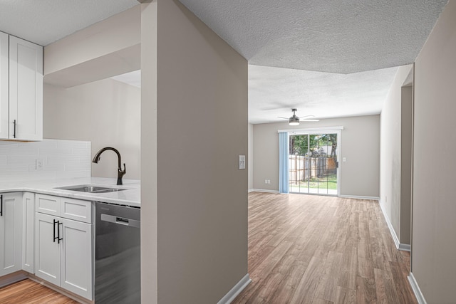 48 4th Ave, Shalimar, FL 32579 - kitchen featuring dishwasher, light wood-type flooring, ceiling fan, light countertops, and tasteful backsplash