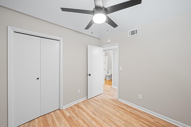 48 4th Ave, Shalimar, FL 32579 - unfurnished bedroom featuring light wood-style floors, a closet, and a ceiling fan