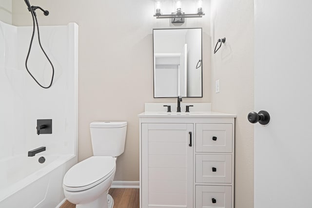 48 4th Ave, Shalimar, FL 32579 - full bathroom featuring vanity,  shower combination, and wood finished floors
