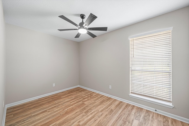 48 4th Ave, Shalimar, FL 32579 - spare room featuring light wood-style floors, healthy amount of natural light, and ceiling fan