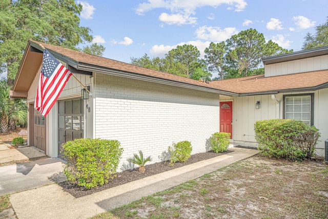 48 4th Ave, Shalimar, FL 32579 - view of front of home featuring brick siding and roof with shingles