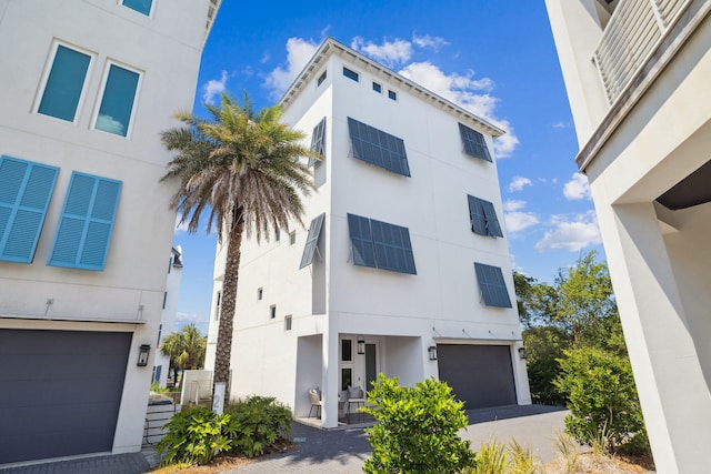21 Scuttle Hole Rd, Santa Rosa Beach, FL 32459 - view of property featuring a garage and driveway