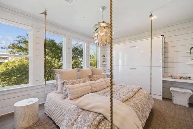 21 Scuttle Hole Rd, Santa Rosa Beach, FL 32459 - bedroom with multiple windows, wood walls, and wood finished floors