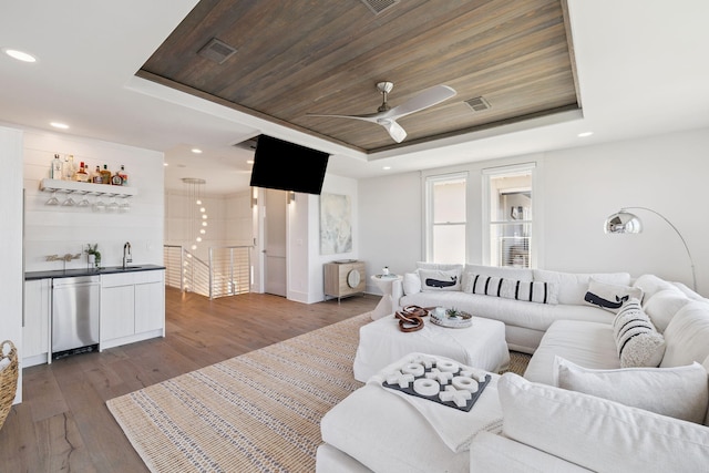 21 Scuttle Hole Rd, Santa Rosa Beach, FL 32459 - living room featuring a raised ceiling, dark wood finished floors, ceiling fan, bar area, and wood ceiling