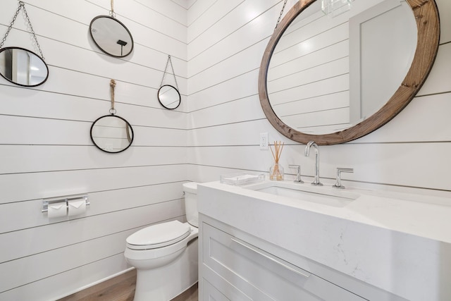 21 Scuttle Hole Rd, Santa Rosa Beach, FL 32459 - bathroom with vanity, wood finished floors, and wooden walls