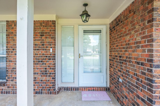 22 James Ave, Shalimar, FL 32579 - doorway to property with brick siding