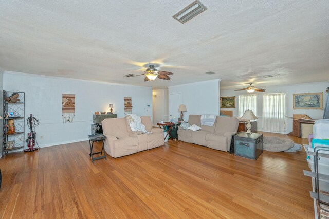 22 James Ave, Shalimar, FL 32579 - living room featuring ceiling fan, a textured ceiling, and wood finished floors