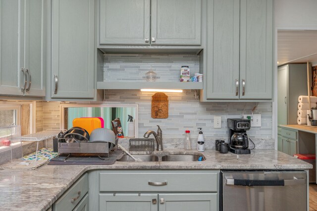 22 James Ave, Shalimar, FL 32579 - kitchen featuring stainless steel dishwasher, backsplash, and light stone counters