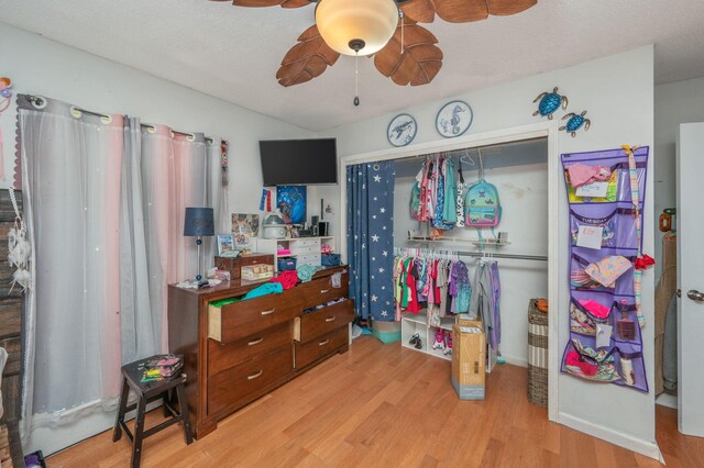 22 James Ave, Shalimar, FL 32579 - bedroom featuring wood finished floors, a closet, ceiling fan, and a textured ceiling