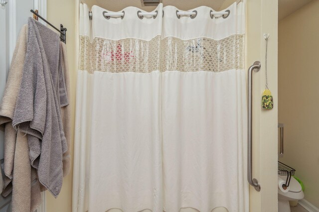 22 James Ave, Shalimar, FL 32579 - full bath featuring baseboards and a shower with shower curtain