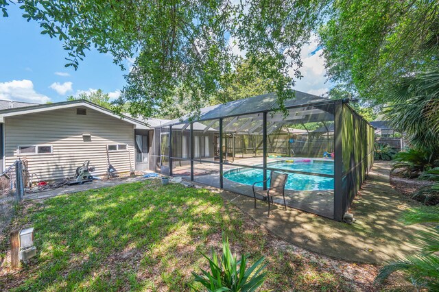 22 James Ave, Shalimar, FL 32579 - back of property with a fenced backyard, a patio area, and a lanai
