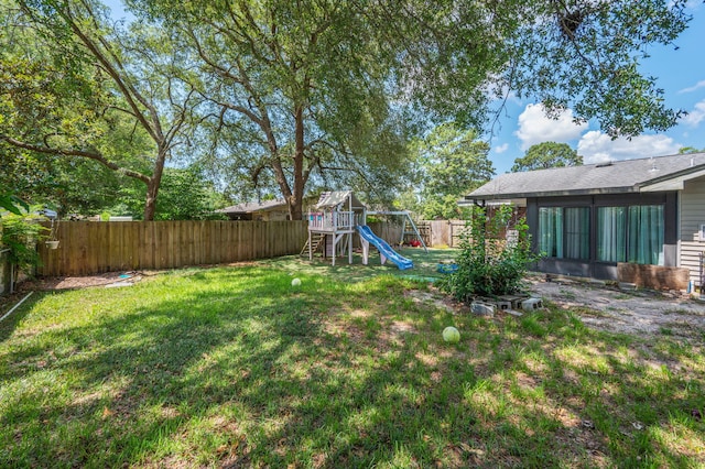 22 James Ave, Shalimar, FL 32579 - fenced backyard featuring a playground