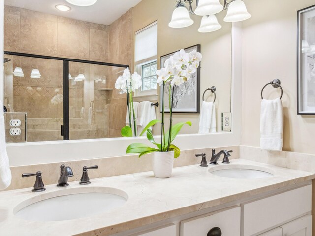 246 Seabreeze Ct, Inlet Beach, FL 32461 - bathroom with tiled shower, double vanity, and a chandelier