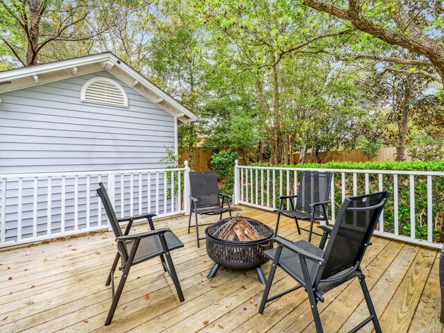 246 Seabreeze Ct, Inlet Beach, FL 32461 - wooden terrace featuring an outdoor fire pit