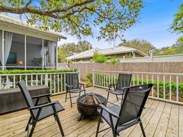 246 Seabreeze Ct, Inlet Beach, FL 32461 - wooden terrace with an outdoor fire pit and a sunroom
