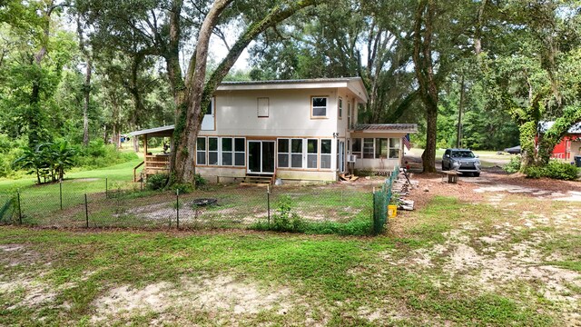 70 River Loop, Ponce De Leon, FL 32455 - rear view of house featuring a sunroom