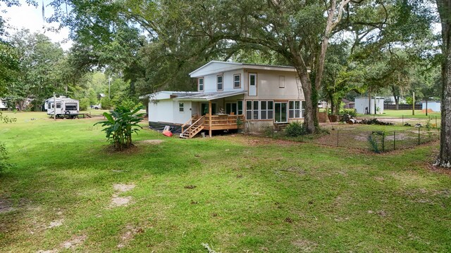70 River Loop, Ponce De Leon, FL 32455 - rear view of house with a lawn