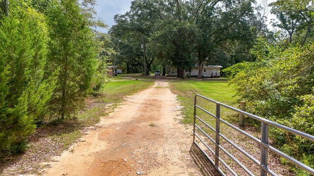 70 River Loop, Ponce De Leon, FL 32455 - view of dirt / gravel road with a gated entry