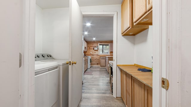 70 River Loop, Ponce De Leon, FL 32455 - washroom with light wood-type flooring, independent washer and dryer, and cabinet space