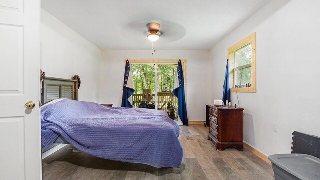 70 River Loop, Ponce De Leon, FL 32455 - bedroom with wood finished floors, access to exterior, and ceiling fan