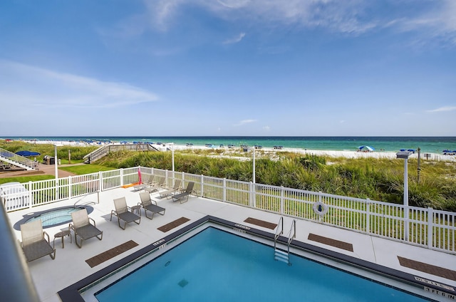 1700 Scenic Highway 98 Unit 101, Destin, FL 32541 - view of pool featuring view of water and beach, a jacuzzi, and a patio area