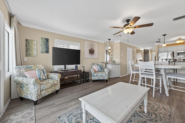 1700 Scenic Highway 98 Unit 101, Destin, FL 32541 - living room with crown molding, ceiling fan, and light wood-style flooring