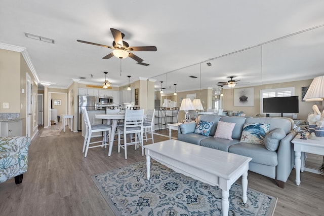 1700 Scenic Highway 98 Unit 101, Destin, FL 32541 - living area featuring ceiling fan, light wood-style flooring, and ornamental molding