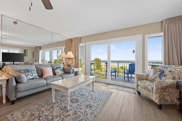 1700 Scenic Highway 98 Unit 101, Destin, FL 32541 - living room featuring light wood-style flooring, ceiling fan, and a water view