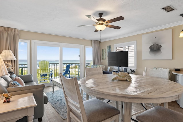 1700 Scenic Highway 98 Unit 101, Destin, FL 32541 - dining area with ceiling fan, light wood-style floors, and crown molding