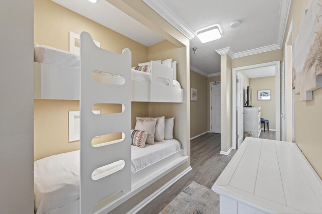 1700 Scenic Highway 98 Unit 101, Destin, FL 32541 - bedroom with ornamental molding and wood finished floors
