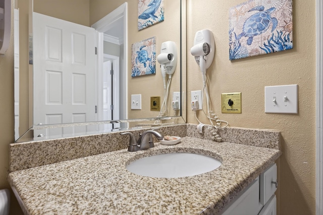 1700 Scenic Highway 98 Unit 101, Destin, FL 32541 - bathroom with vanity and a textured wall