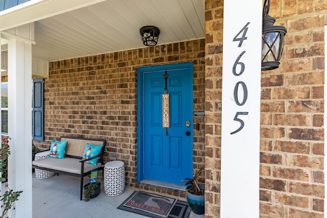 4605 Plover Dr, Crestview, FL 32539 - doorway to property with brick siding and covered porch