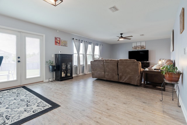 4605 Plover Dr, Crestview, FL 32539 - living area featuring french doors, ceiling fan, and light wood-style flooring