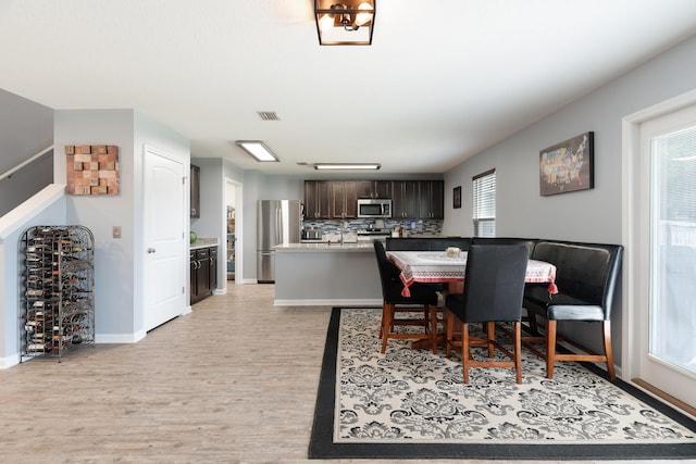 4605 Plover Dr, Crestview, FL 32539 - dining space featuring light wood-style flooring and baseboards