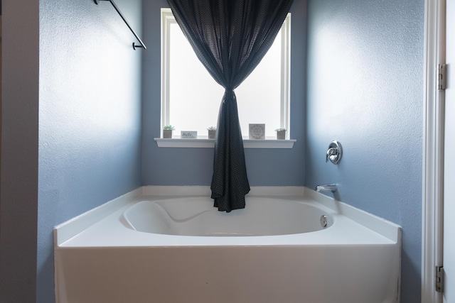 4605 Plover Dr, Crestview, FL 32539 - bathroom with a bath and a textured wall
