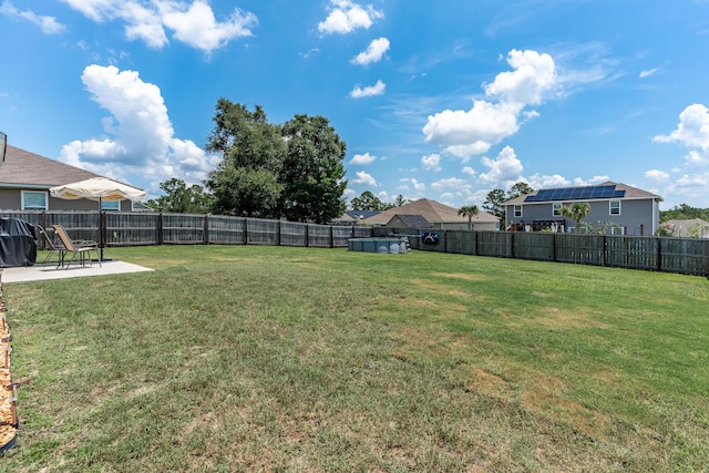 4605 Plover Dr, Crestview, FL 32539 - fenced backyard with a patio area