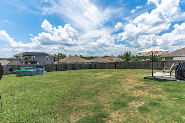 4605 Plover Dr, Crestview, FL 32539 - fenced backyard with a patio area