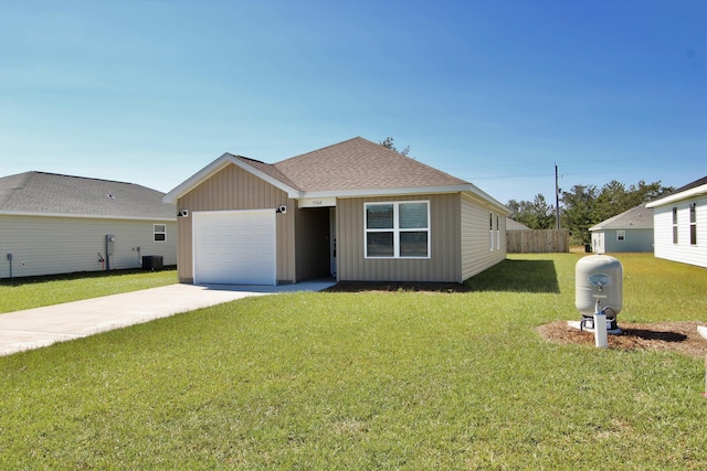 5360 Highview Dr, Crestview, FL 32539 - view of front facade with driveway, board and batten siding, an attached garage, a front lawn, and roof with shingles