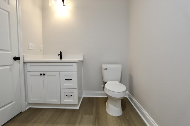 5360 Highview Dr, Crestview, FL 32539 - half bathroom featuring wood finished floors and vanity