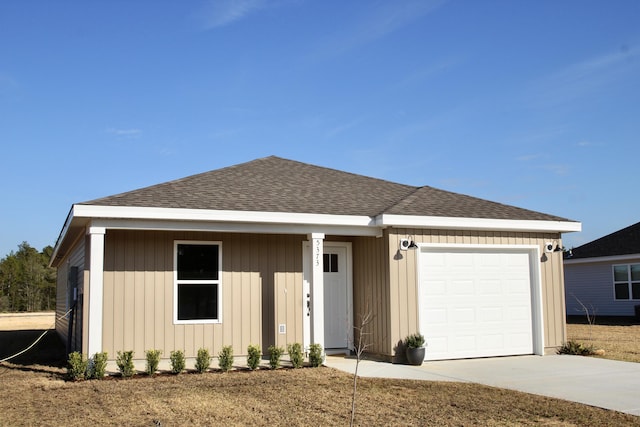 5367 Highview Dr, Crestview, FL 32539 - view of front of house with concrete driveway, a garage, and roof with shingles