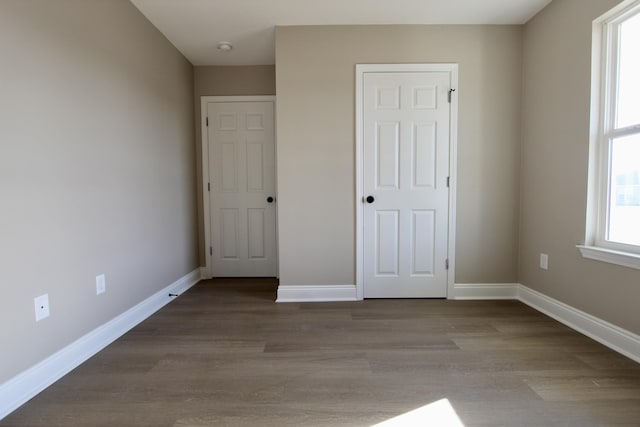 5367 Highview Dr, Crestview, FL 32539 - unfurnished bedroom featuring wood finished floors and baseboards