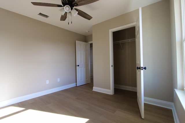 5367 Highview Dr, Crestview, FL 32539 - unfurnished bedroom with light wood-style flooring, a closet, and a ceiling fan