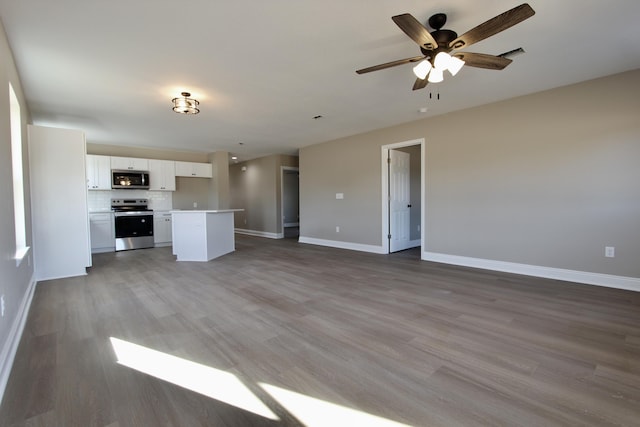 5367 Highview Dr, Crestview, FL 32539 - unfurnished living room featuring light wood-style flooring and ceiling fan