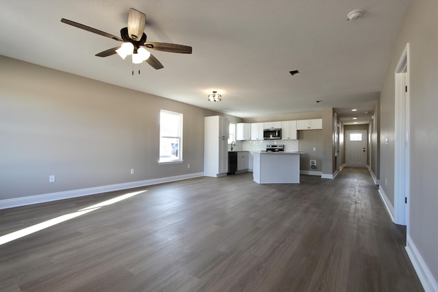 5367 Highview Dr, Crestview, FL 32539 - unfurnished living room featuring dark wood-type flooring and a ceiling fan